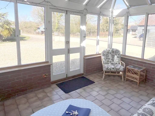 The Farmhouse Outside and Living spaces