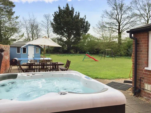 The Farmhouse Outside and Living spaces